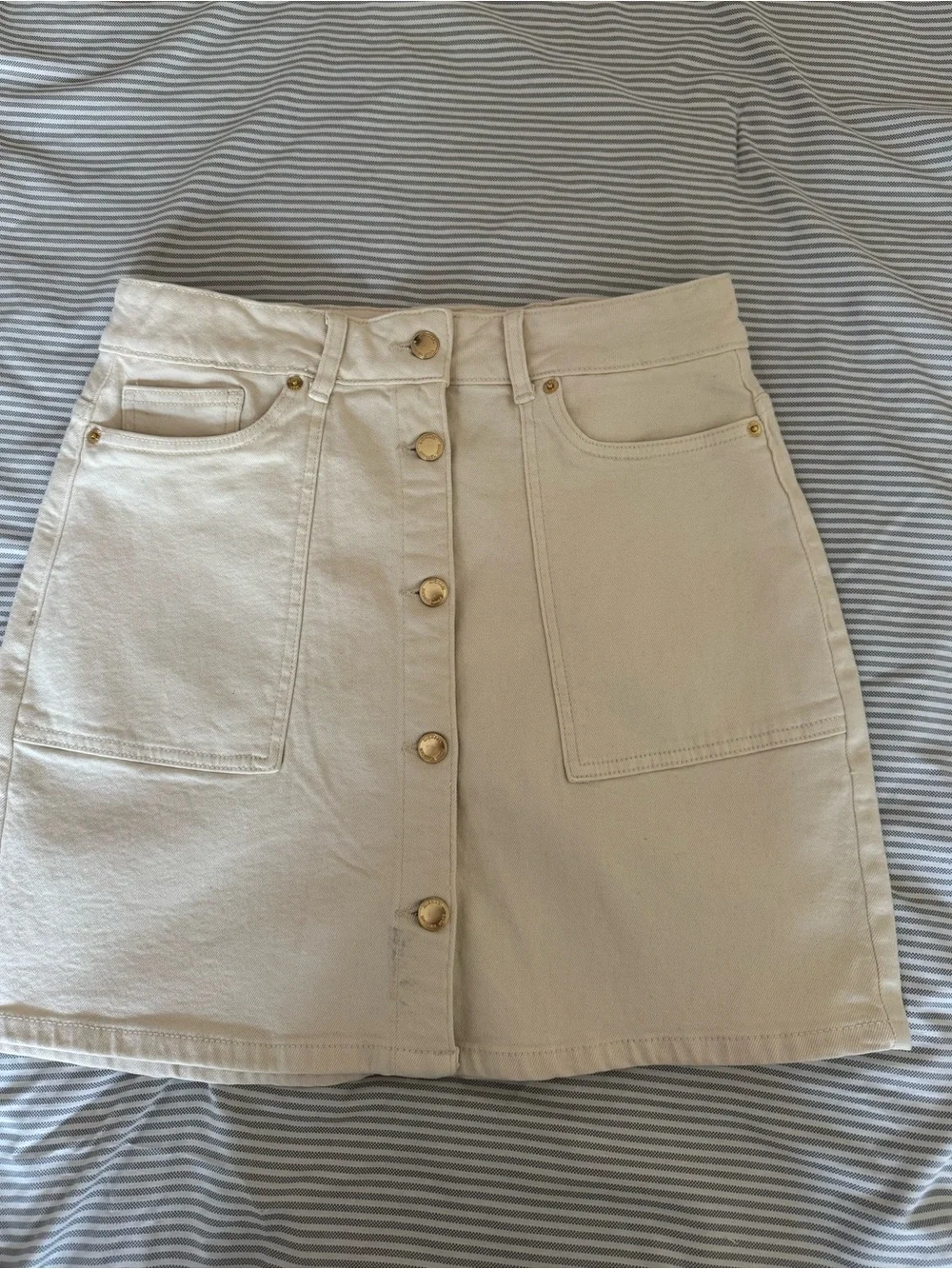 Michael Kors: Button-Front Cream Mini Skirt